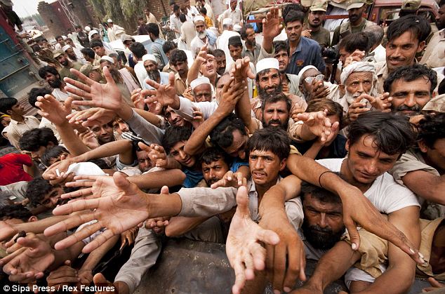 Figure 6 Pakistani army gives relief supplies to flood-affected people in the district of Nowshera  